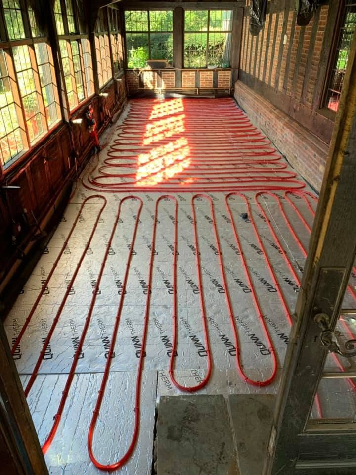 Wet underfloor heating pipework laid on insulation boards
